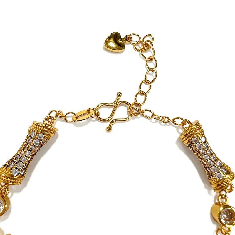 Sculpted link bracelet stacked on the wrist