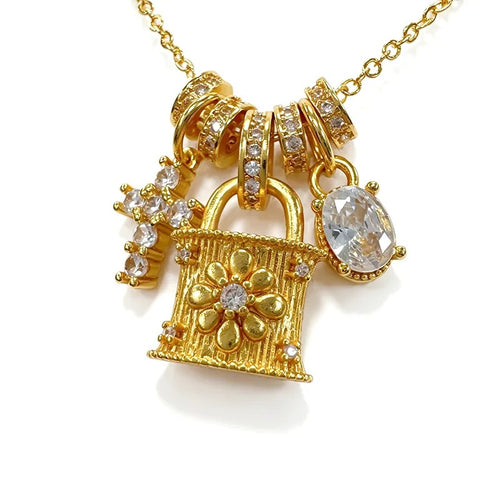 Close-up of the three gold charms
