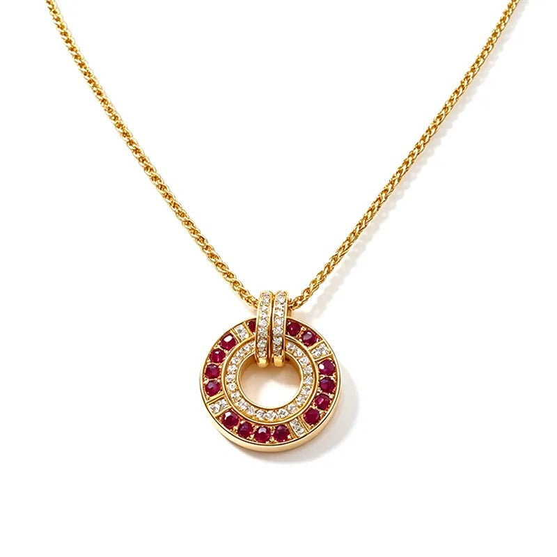 Gold necklace with interlocking rings and red stones