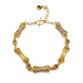Gold sculpted link bracelet with alternating pavé links
